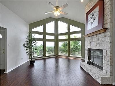 Walls of windows and a vaulted ceiling create such an open, rela