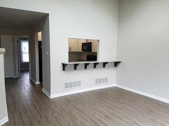 Great Room looking into Kitchen and down Hallway to 2nd bedroom and bath