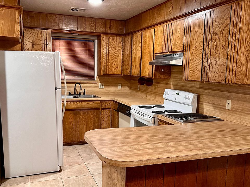 Kitchen includes full-size refrigerator, stove, dishwasher and indoor Jenn-Air grill.