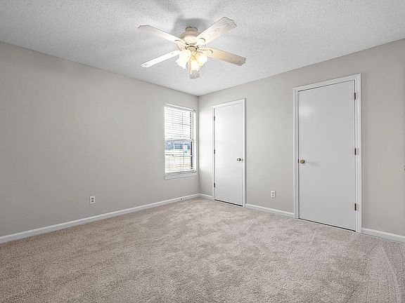 Bedroom with wall-to-wall closets