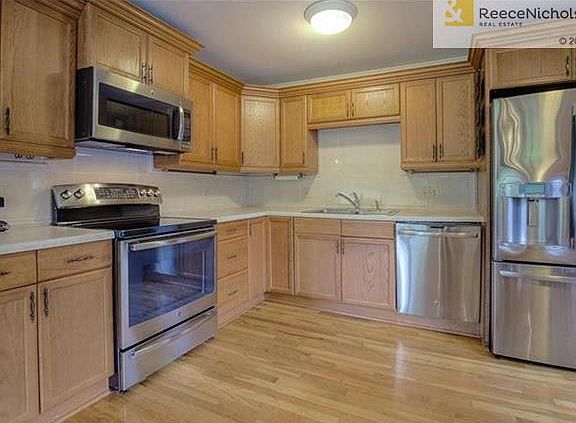 Newer Stainless Appliances & Hardwood floors in Kitchen