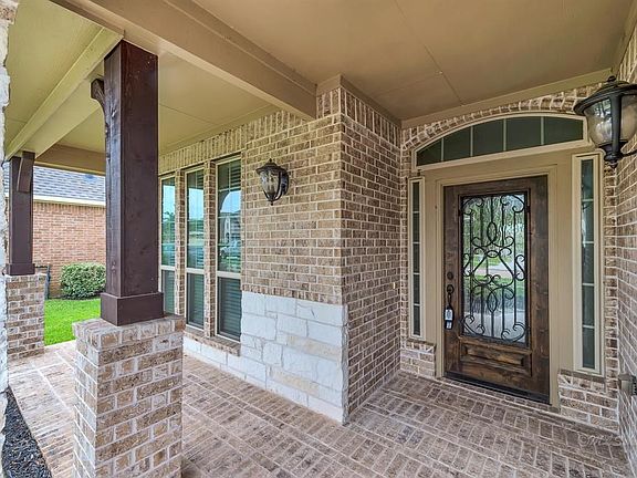 Brick and stone front porch to welcome guests and you home