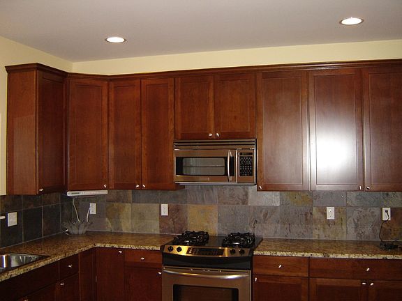 Kitchen with granite counter tops and maple cabinets