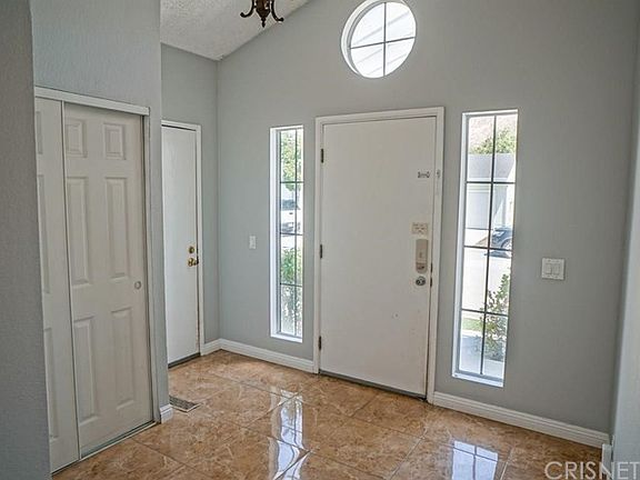 Front door with plenty of natural light and opens