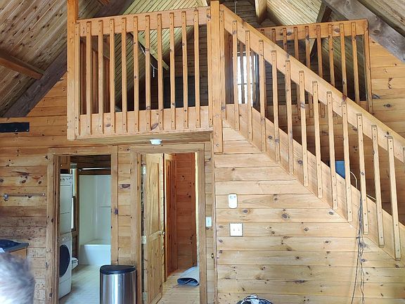 Loft space that can be used as a bedroom or a office space.