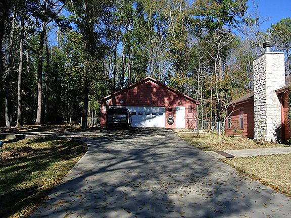 Over sized garage with half bath and work space