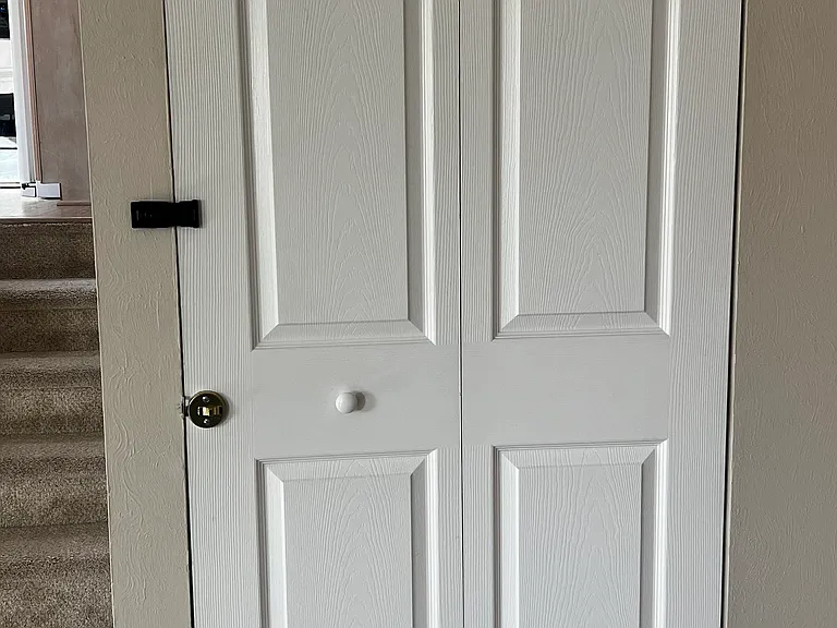 Private basement suite entrance door (shared main entrance upstairs).