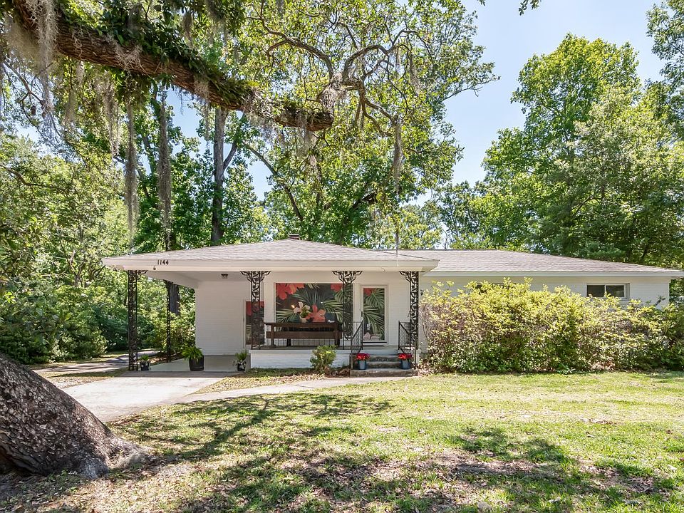Exterior of the home with off-street parking and a covered carport