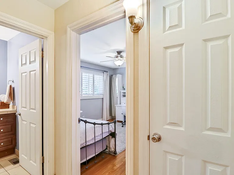 Back hallway that connects third bedroom and second bathroom--includes large coat closet.