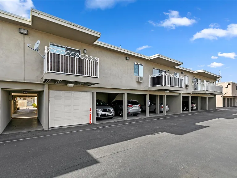 Well-kept carports and upper-level one-bedroom residences showcasing generous balcony space.