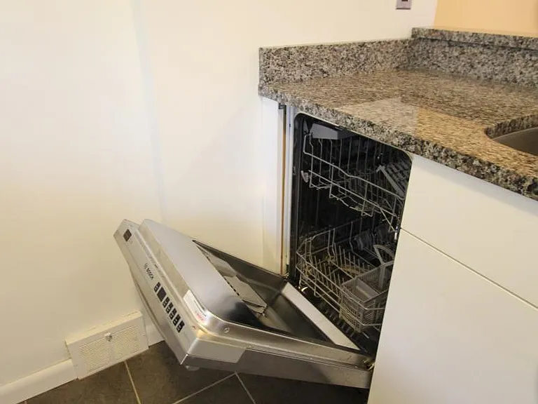 Kitchen equipped with stainless steel dishwasher