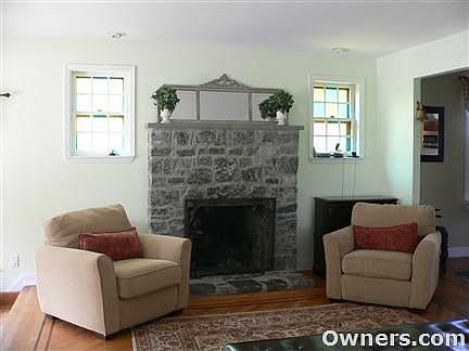 stone fireplace and stained glass in LR