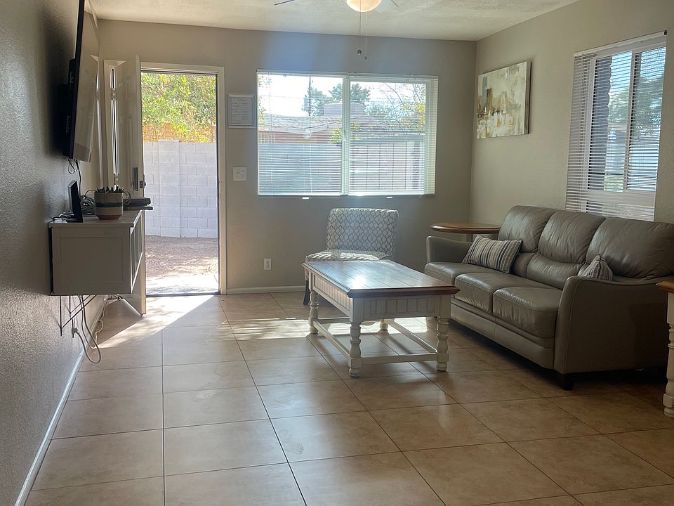 Living room with front door / access to the shared yard