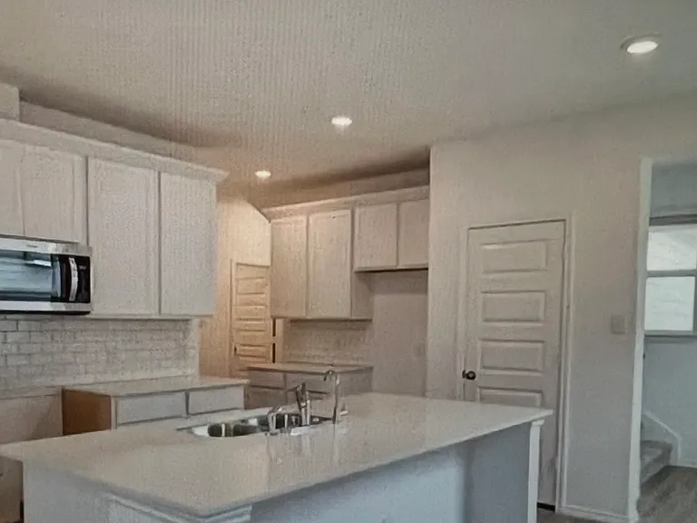 Kitchen, room for table and stools for extra seating
