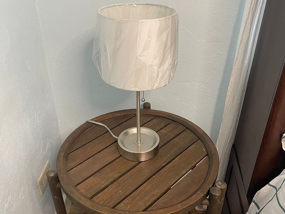 Bedside table with lamp.