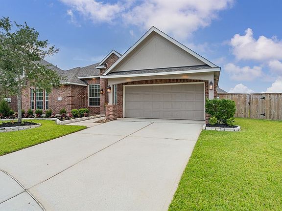 Double wide driveway provides plenty of parking for guests.
