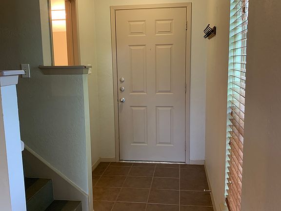 View of front door from living area