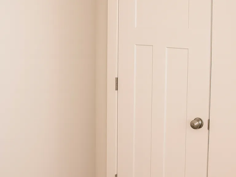Bright and comfortable guest bedroom with neutral tones, closet storage in all the bedrooms .