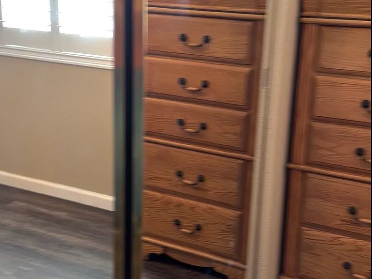 Mirrored closet in back bedroom