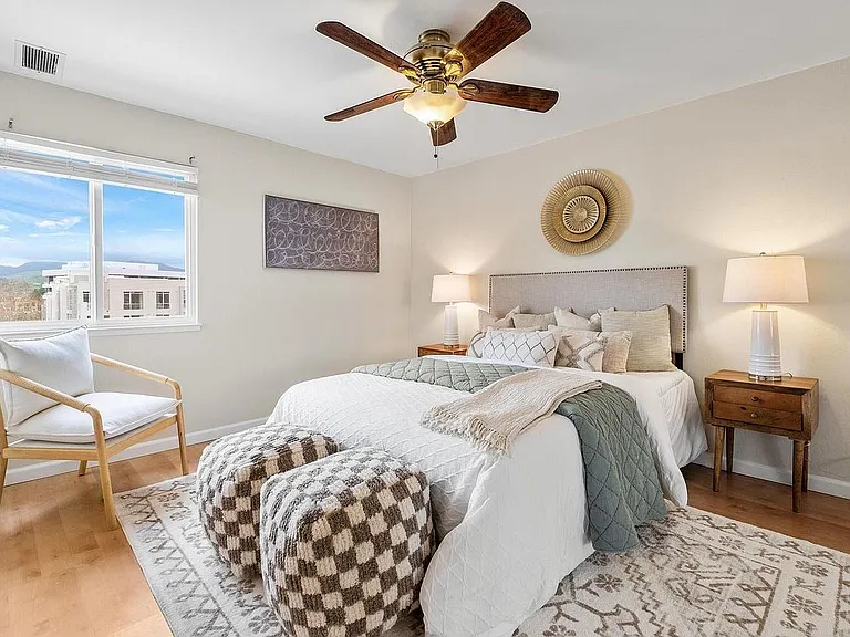 Master bedroom with views of mountains outside window