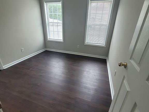 One of the smaller bedrooms, with good sized closet. Ceiling fans in every room.