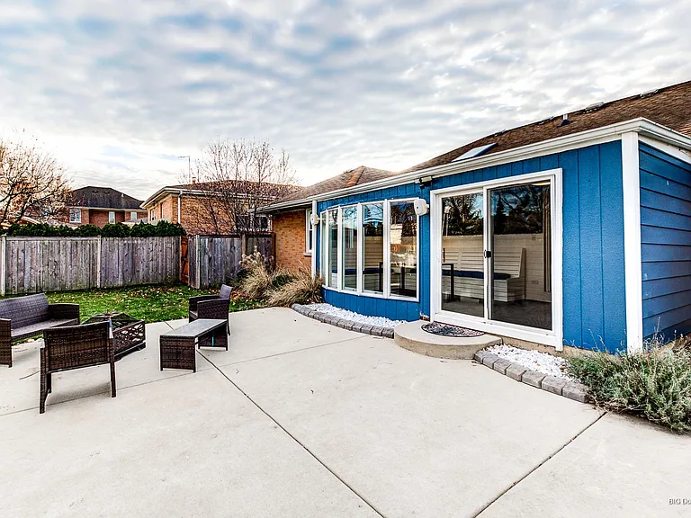 sunroom and wood fire pit outside
