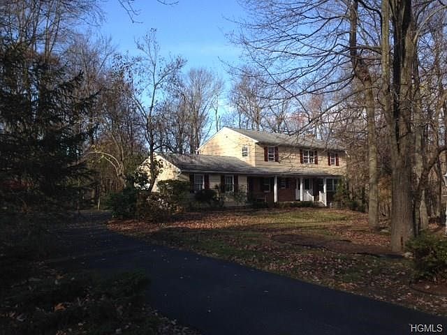 Home comes with two acres of property. Updated photo to come.