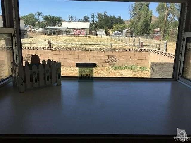 View of Riding Arena and Horse Corrals from Kitchen Window.