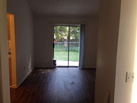 Living room with slider to fenced yard