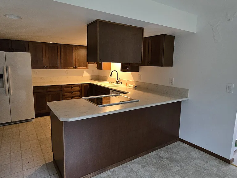 BEAUTIFUL KITCHEN!! Open Pantry concept. looks out to Dining area and entered from laundry room from outside.