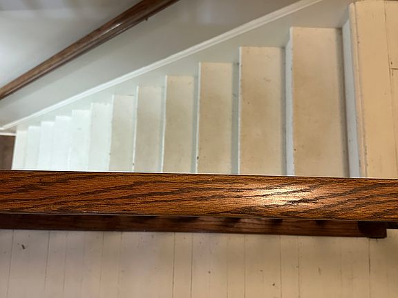 Stairwell with original hardwood floors