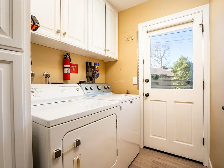 Washer and dryer located inside home for easy access with door to back yard.