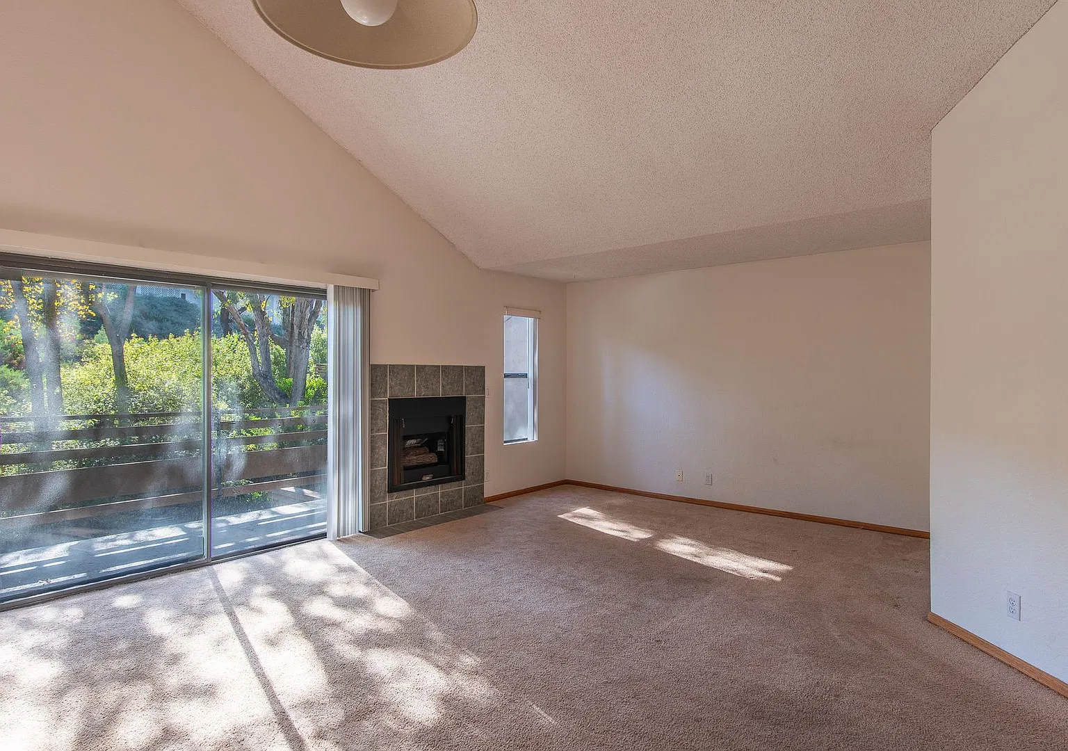 Top-Floor Living: Vaulted Ceilings, Balcony, A/C & Community Pool — Photo 4