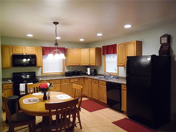Open, fully-equipped country kitchen features an ABUNDANT cabinetry package, LOTS of countertop spac