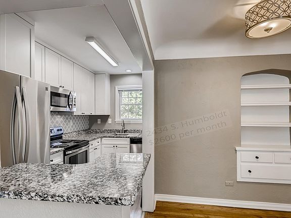Kitchen and Dining Area with Built-In Hutch 42 inch Upper Cabinets, Granite Counters, Refrigerator with Icemaker, Electric Stove/Oven, Built-In Microwave, Dishwasher