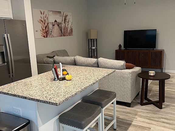 Kitchen with island and seating for 2 is open concept.