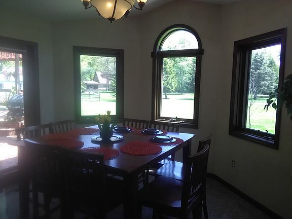 Dining area comfortably seats 8 or more.
						:
						Natural light and beautiful outdoor views are highlights of this dining area.