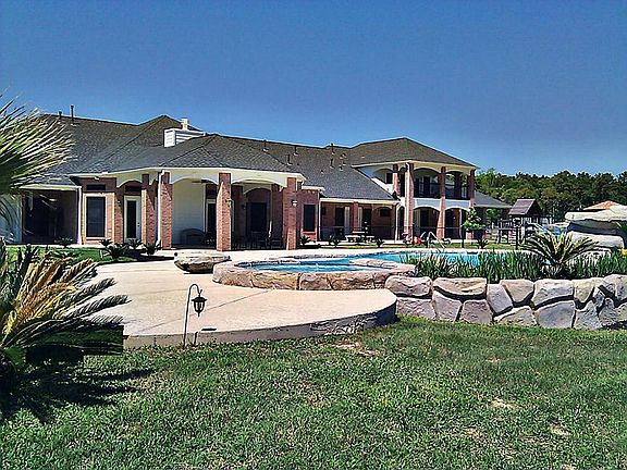 Gorgeous heated Gunite diving pool with grotto separating the kids pool from the spa.