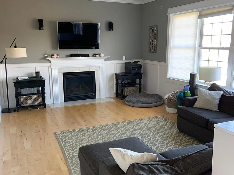 Furnished living area adjacent to kitchen.