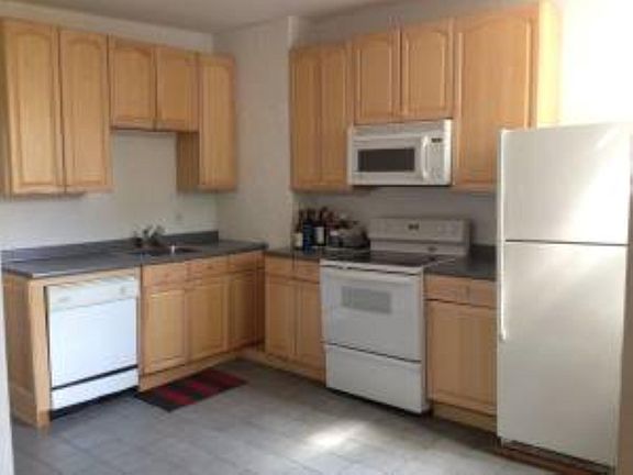 Open kitchen to living space-
dishwasher, oven, stove, microwave and refrigerator. Stove and dishwasher have been updates since photo.