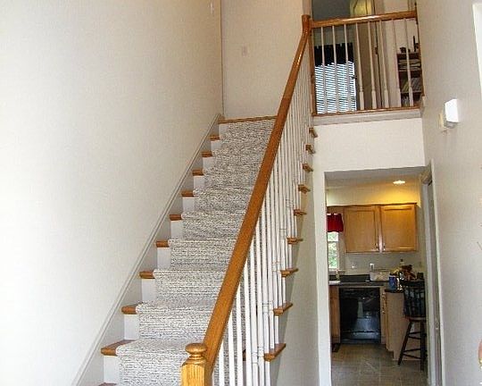 Foyer leading upstairs and into the kitchen