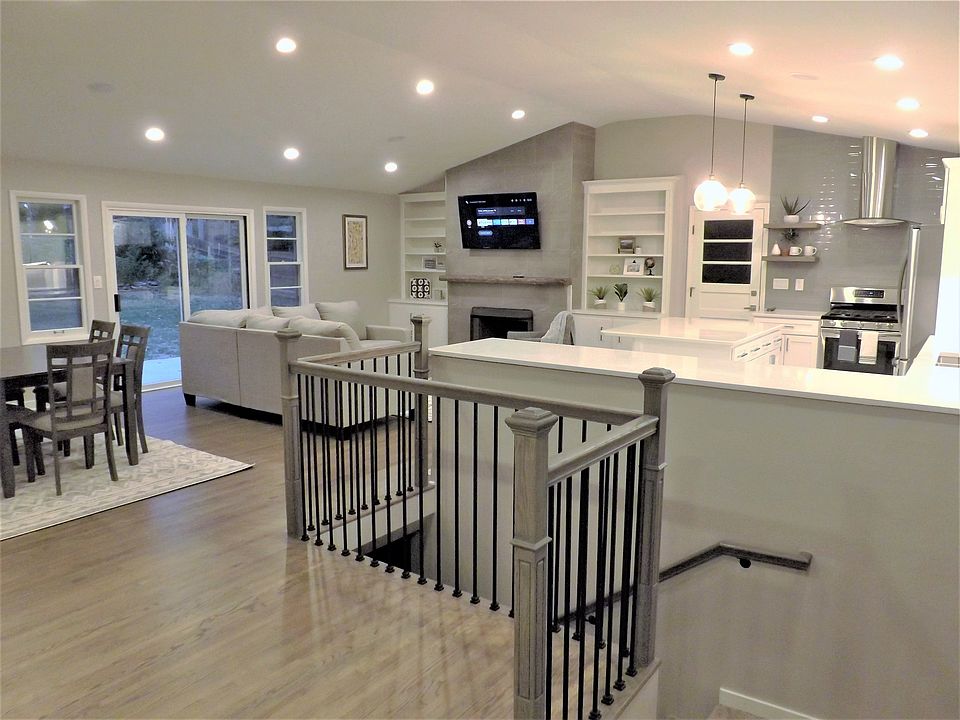 Extremely open gathering area comfortably accommodates 16 people. You must see the "Before" pics to appreciate how amazing this transformation is.