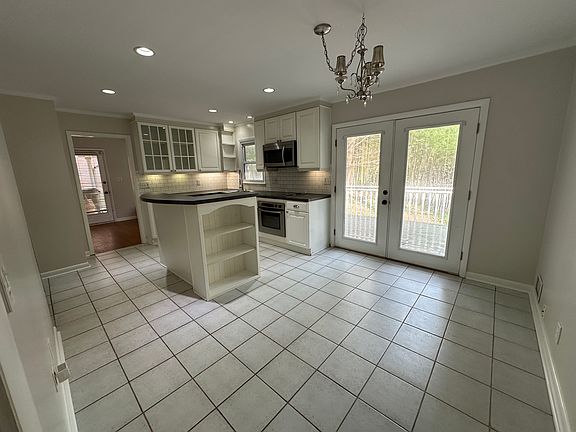 kitchen dining area with French doors leading to large deck