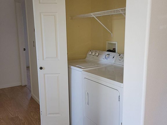 Laundry area in the hallway. Includes washer and dryer.