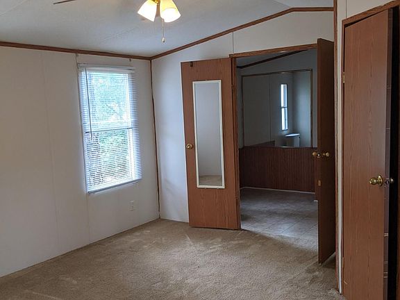 Master bedroom with private bath and vaulted ceilings
