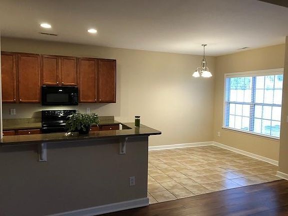 View of dining room and kitchen from living area