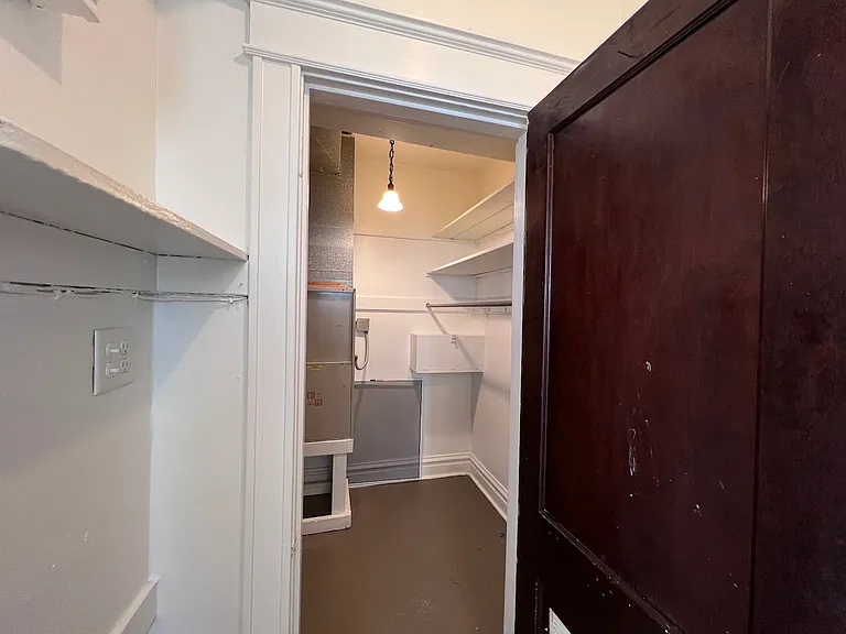 Spacious closet with lots of shelving to maximize the use of vertical space.