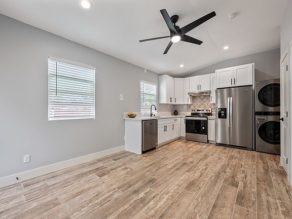 View of living room and kitchen. Everything is brand new. Built in 2025