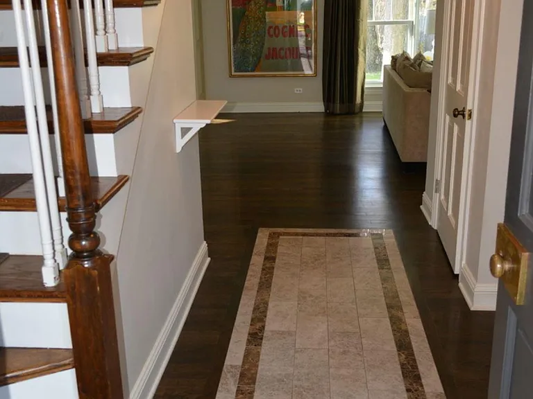 Front entry with inset tile and font hall coat closet, Newer hardwood floors throughout the first and second floors.