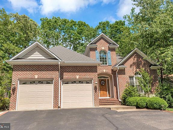 Brick-front transitional, custom golf-course home